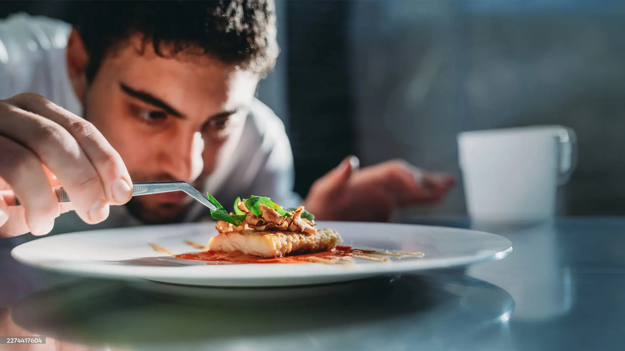 chef garnishing dish